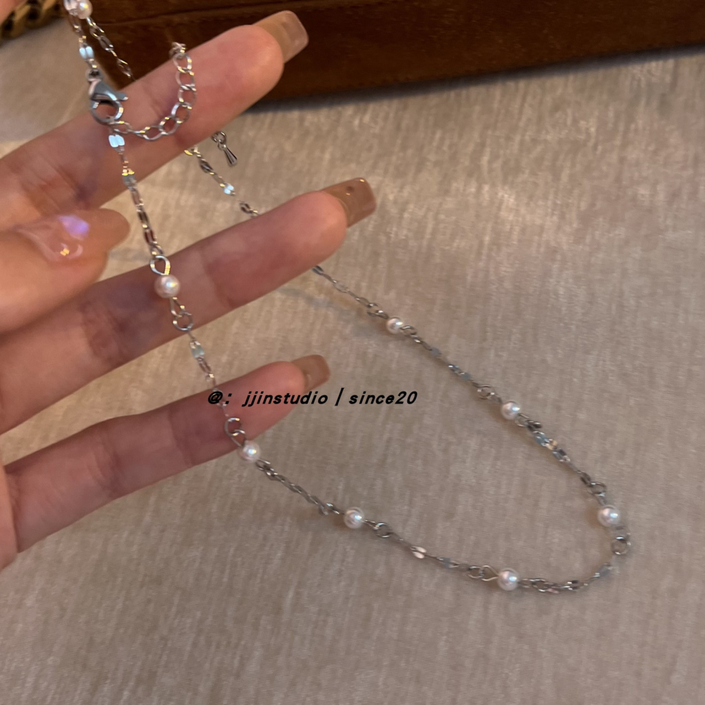 add a pearl necklace